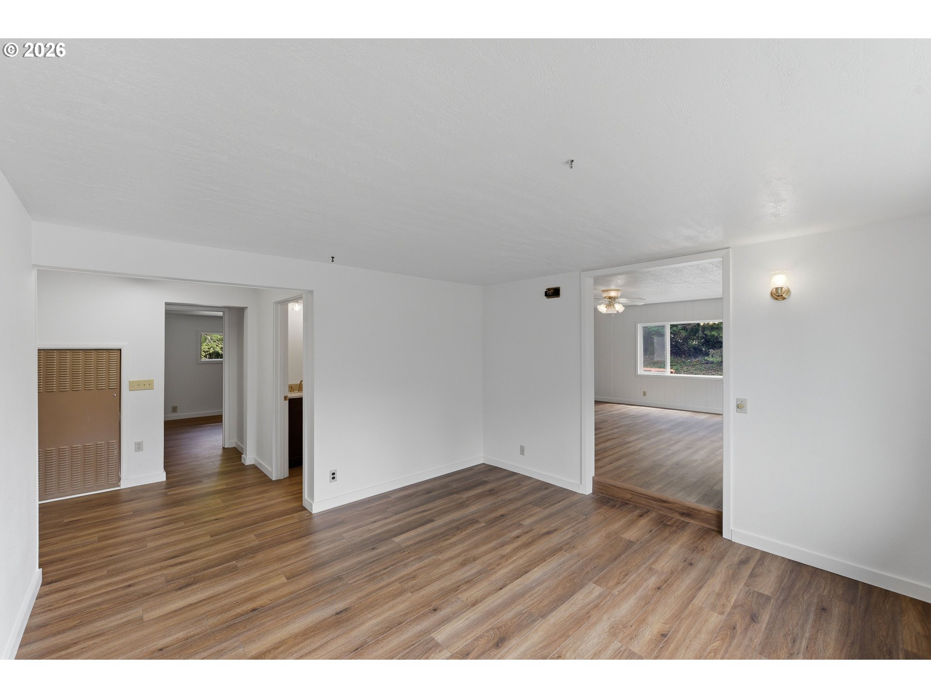 63299 Wildahl Road Coos Bay, OR 97420 - Photo 20 of 45 a view of an empty room with wooden floor and closet