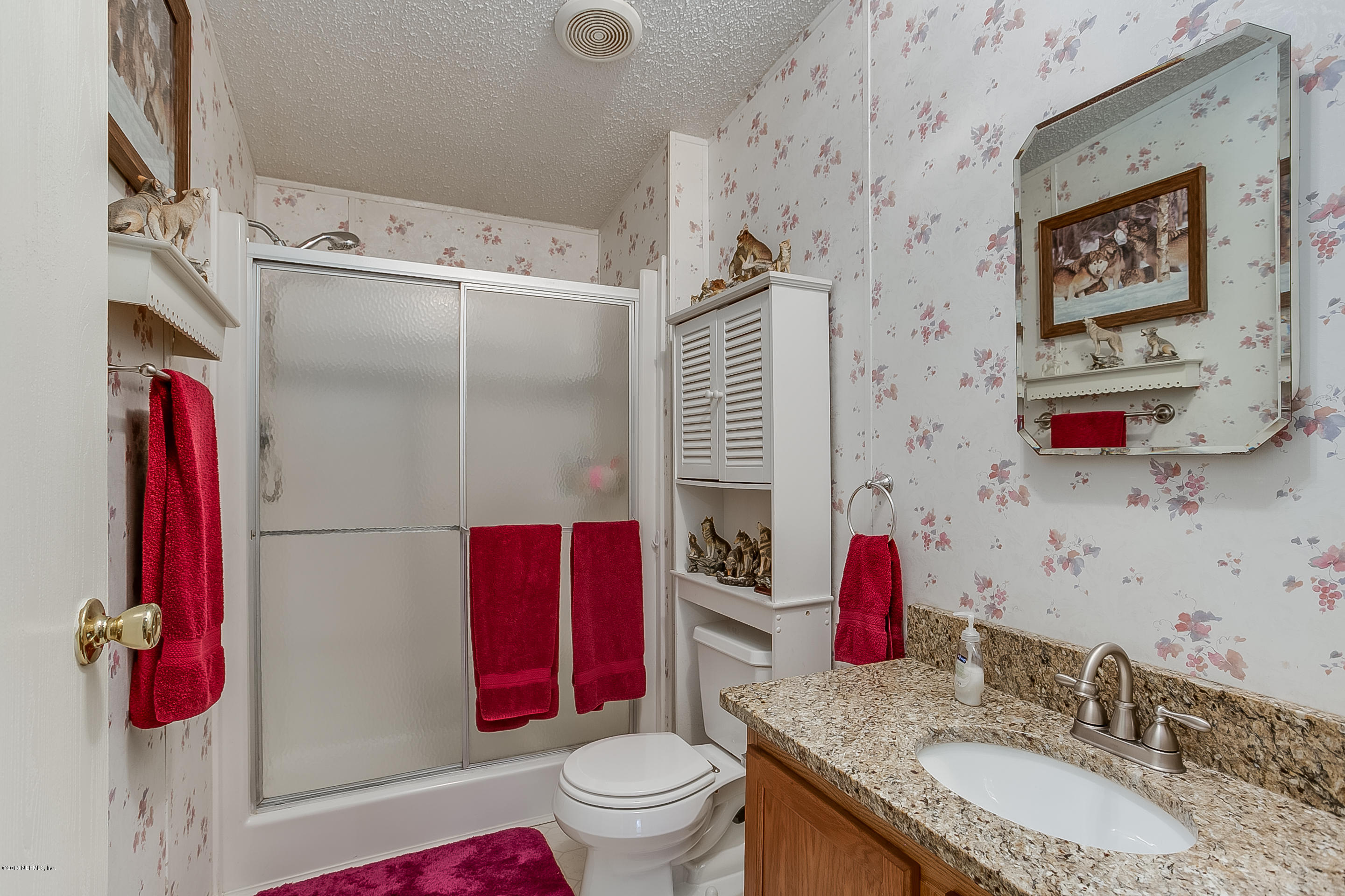 13278 Grover Road Jacksonville, FL 32226 - Photo 16 of 26 a bathroom with a sink toilet and shower
