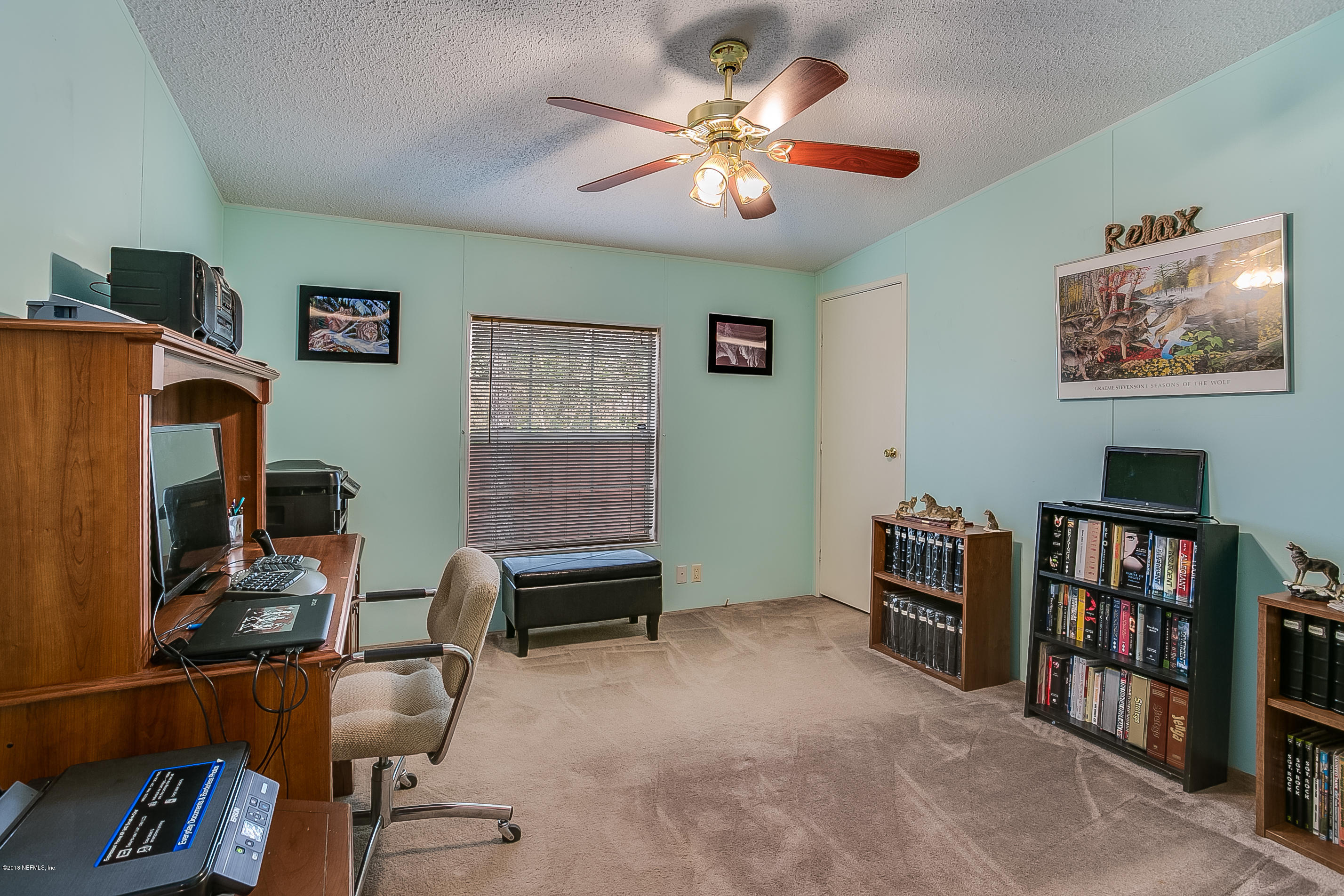 13278 Grover Road Jacksonville, FL 32226 - Photo 18 of 26 a view of a workspace with furniture and toys