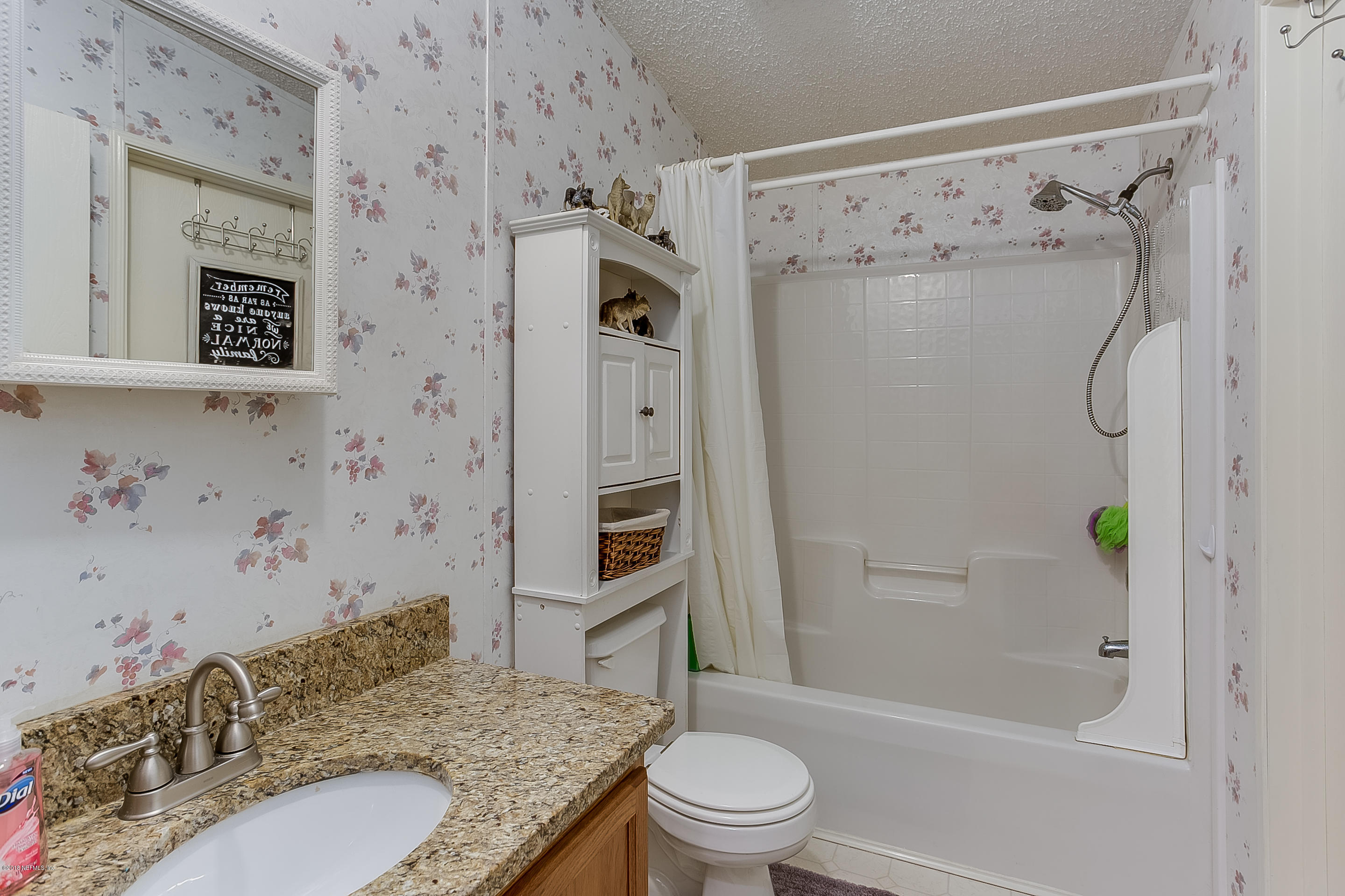 13278 Grover Road Jacksonville, FL 32226 - Photo 19 of 26 a bathroom with a granite countertop sink toilet and shower