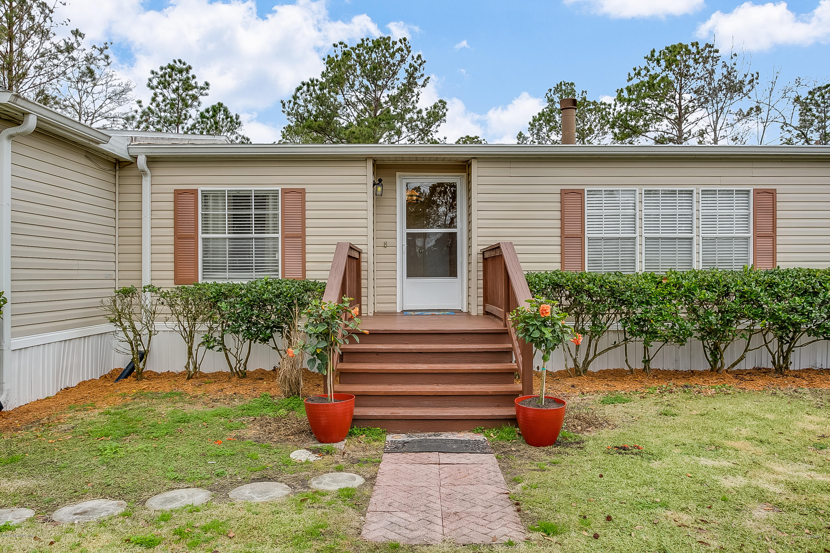 13278 Grover Road Jacksonville, FL 32226 - Photo 2 of 26 a view of backyard with a garden and plants