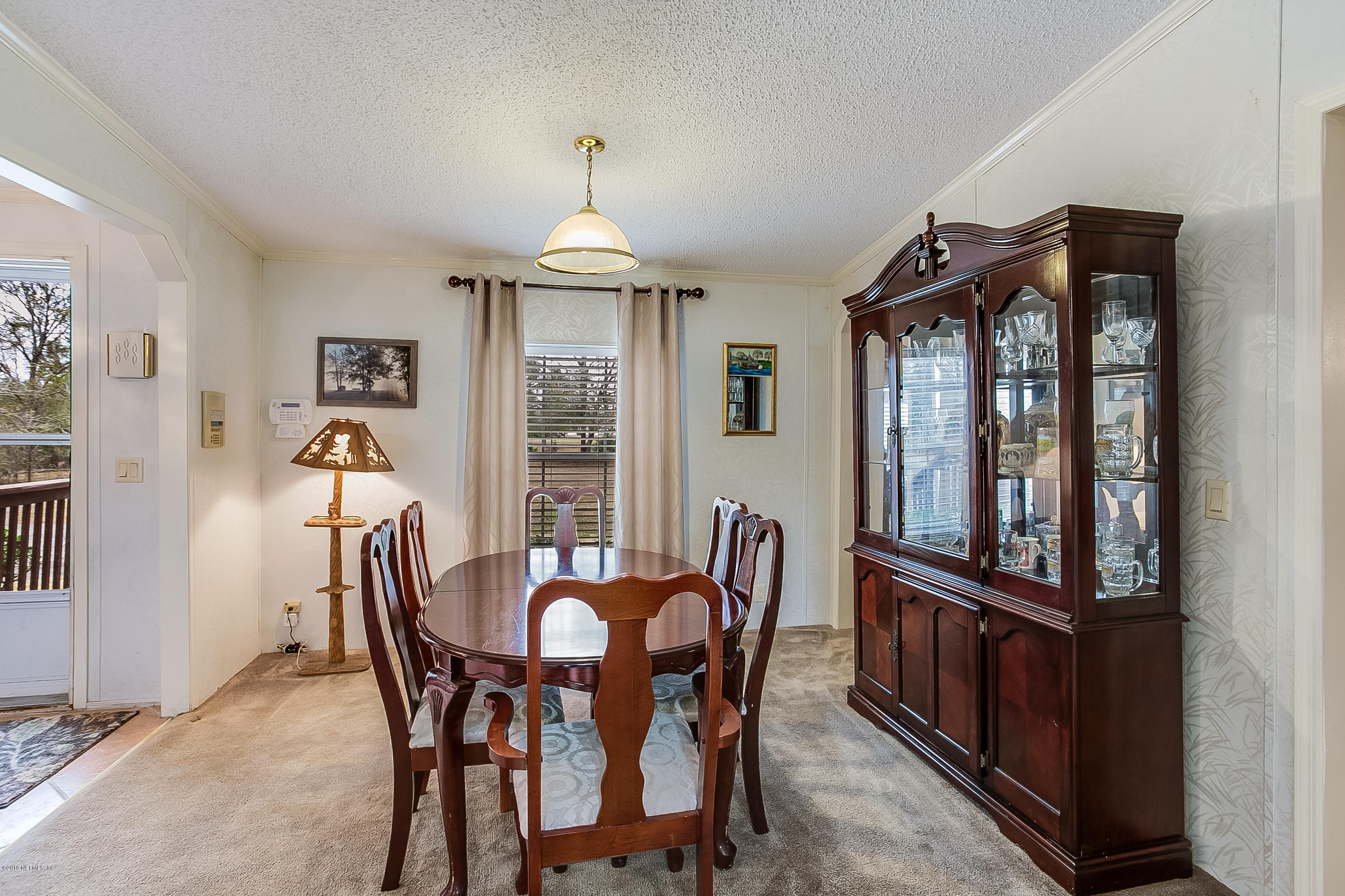 13278 Grover Road Jacksonville, FL 32226 - Photo 3 of 26 a view of a dining room with furniture window and wooden floor