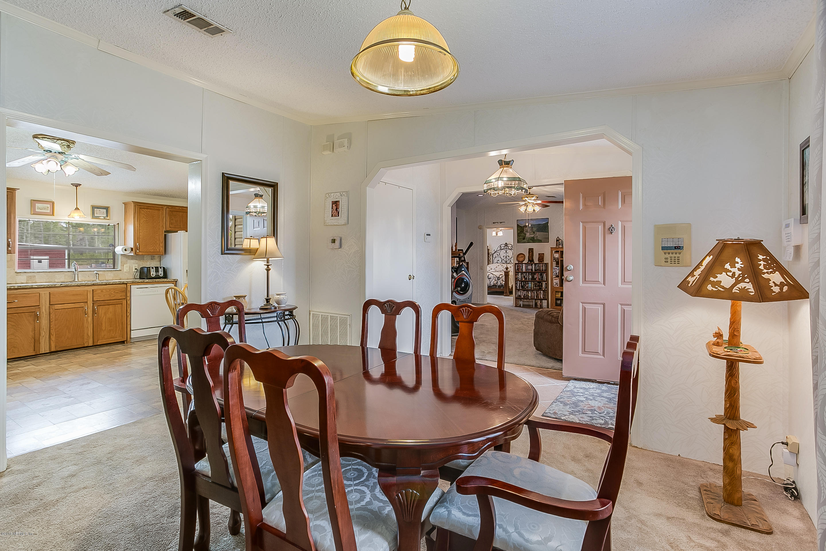 13278 Grover Road Jacksonville, FL 32226 - Photo 4 of 26 a view of a dining room with furniture and wooden floor