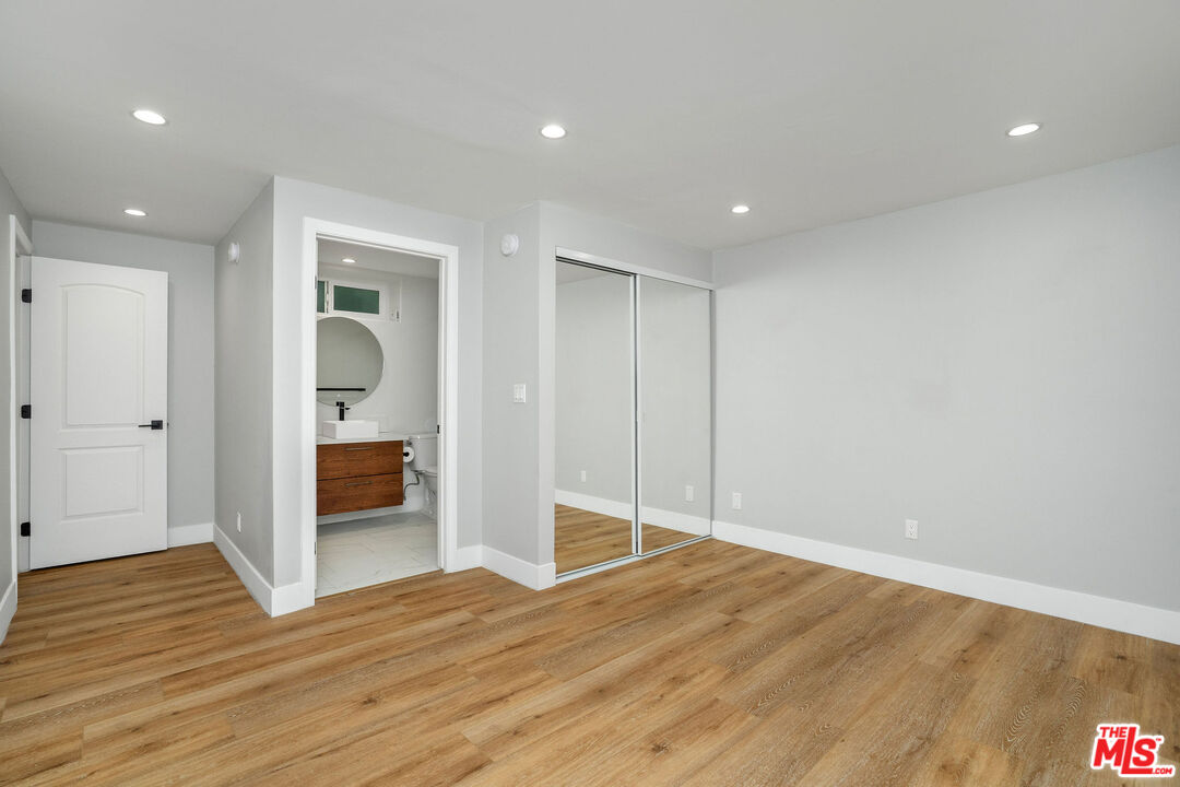 5923 Etiwanda Avenue, Unit 106 Tarzana, CA 91356 - Photo 17 of 27 a view of empty room with wooden floor