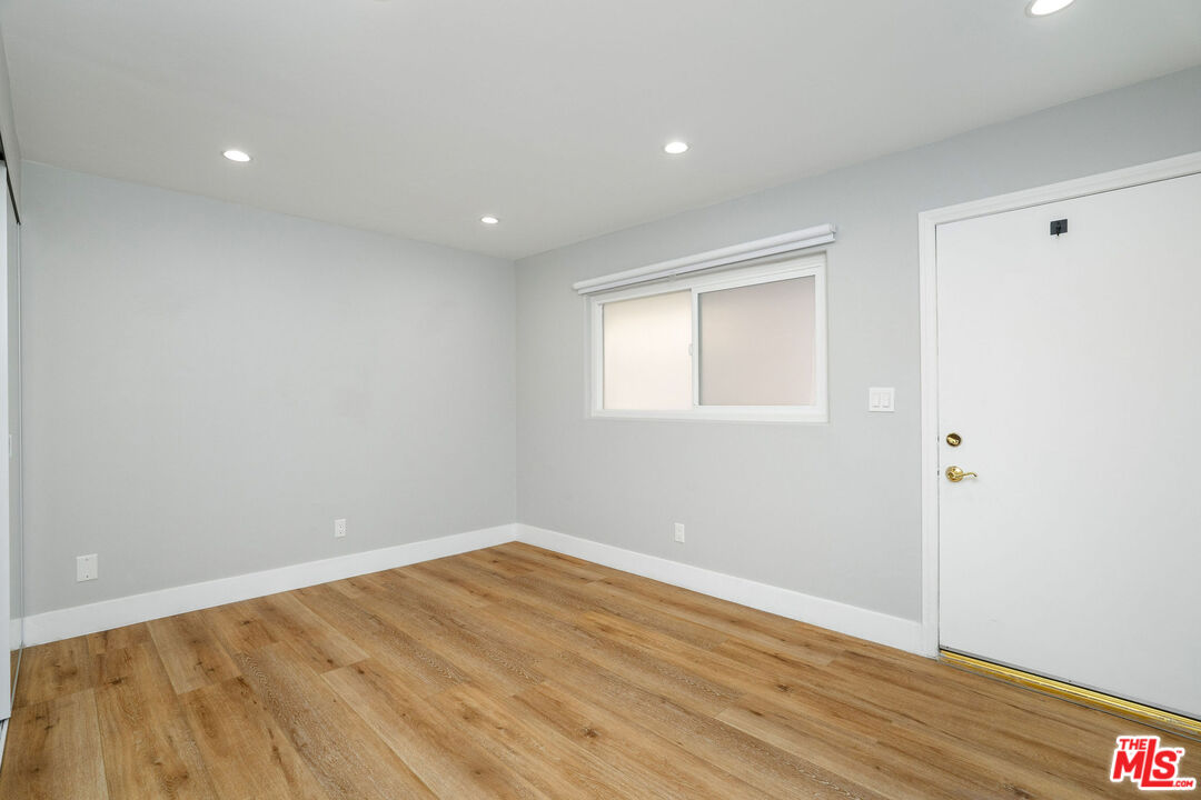 5923 Etiwanda Avenue, Unit 106 Tarzana, CA 91356 - Photo 23 of 27 a view of empty room with wooden floor