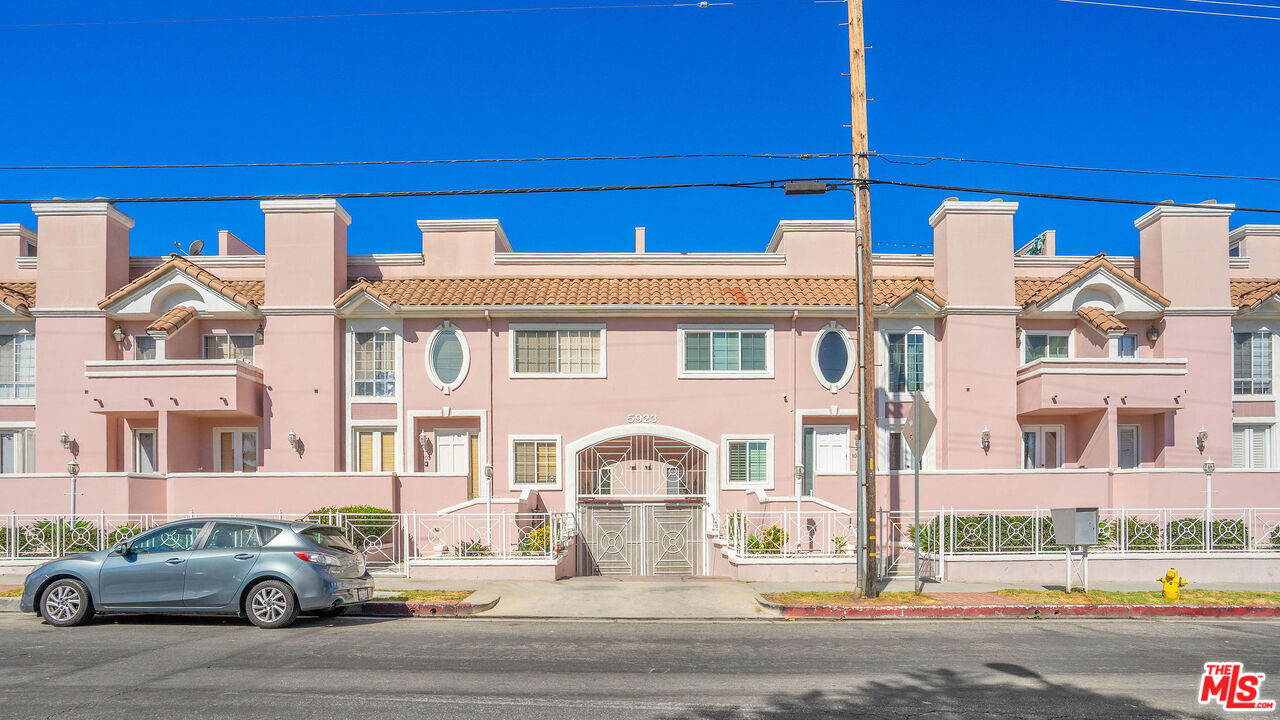 5923 Etiwanda Avenue, Unit 106 Tarzana, CA 91356 - Photo 27 of 27 a front view of a building with parking