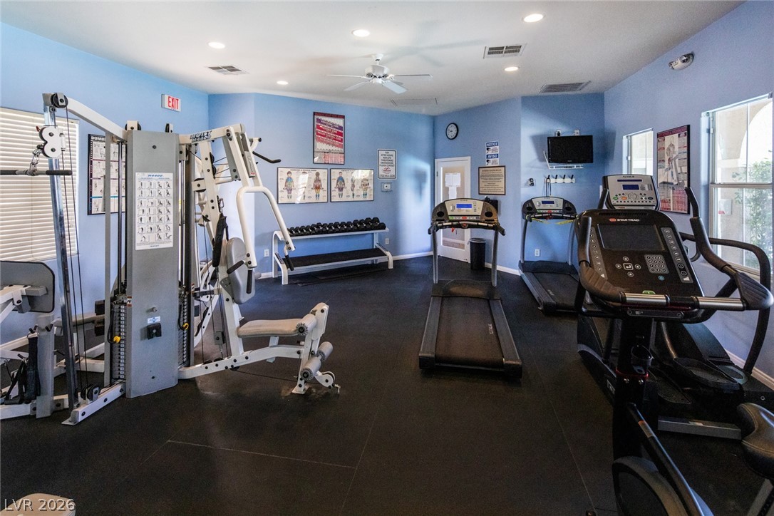 10550 West Alexander Road, Unit 1097 Las Vegas, NV 89129 - Photo 28 of 37 Recessed lighting and large windows illuminate the spacious fitness room with durable flooring.