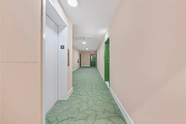 a view of a hallway with a white walls