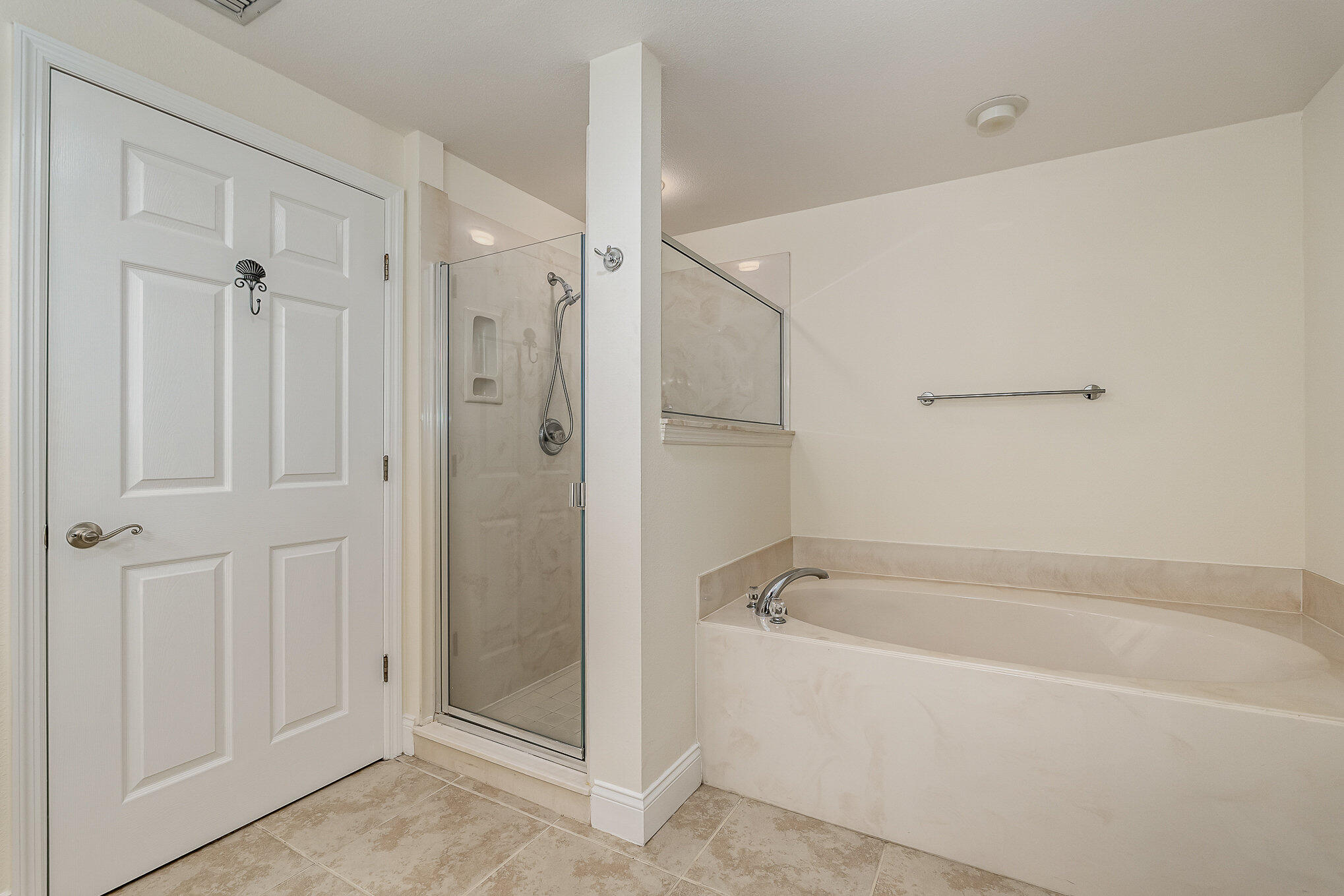 125 Pulsipher Avenue, Unit 402 Cocoa Beach, FL 32931 - Photo 20 of 34 a white bath tub sitting next to a shower