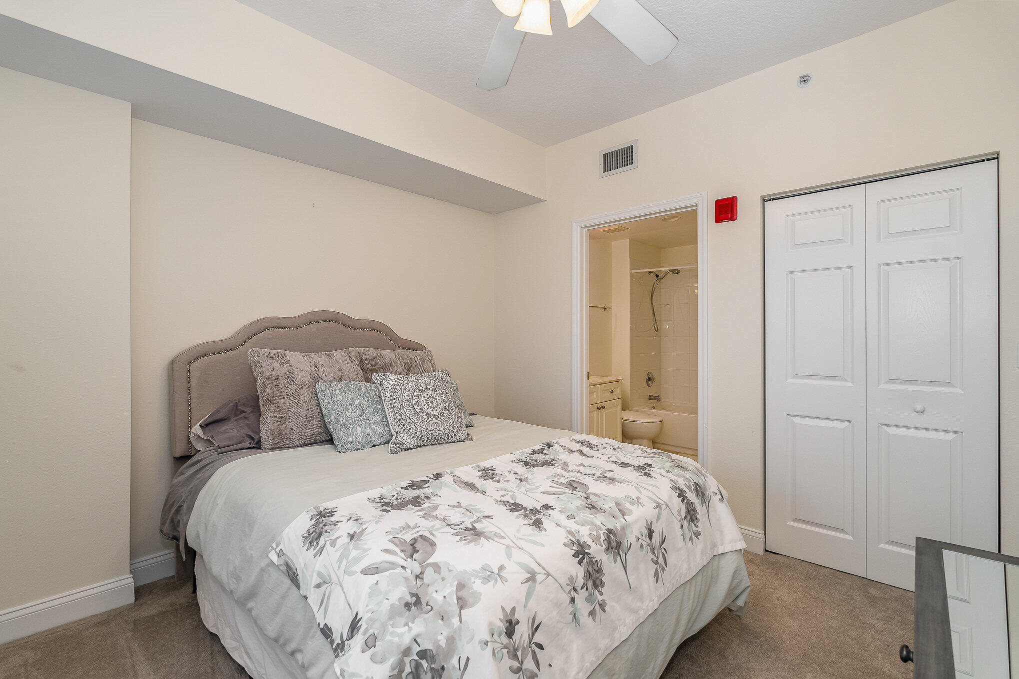 125 Pulsipher Avenue, Unit 402 Cocoa Beach, FL 32931 - Photo 24 of 34 a bedroom with a bed and a window