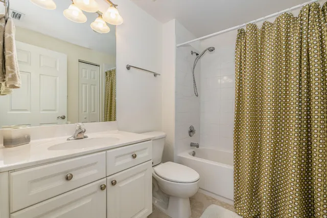 a bedroom with a bed and a television