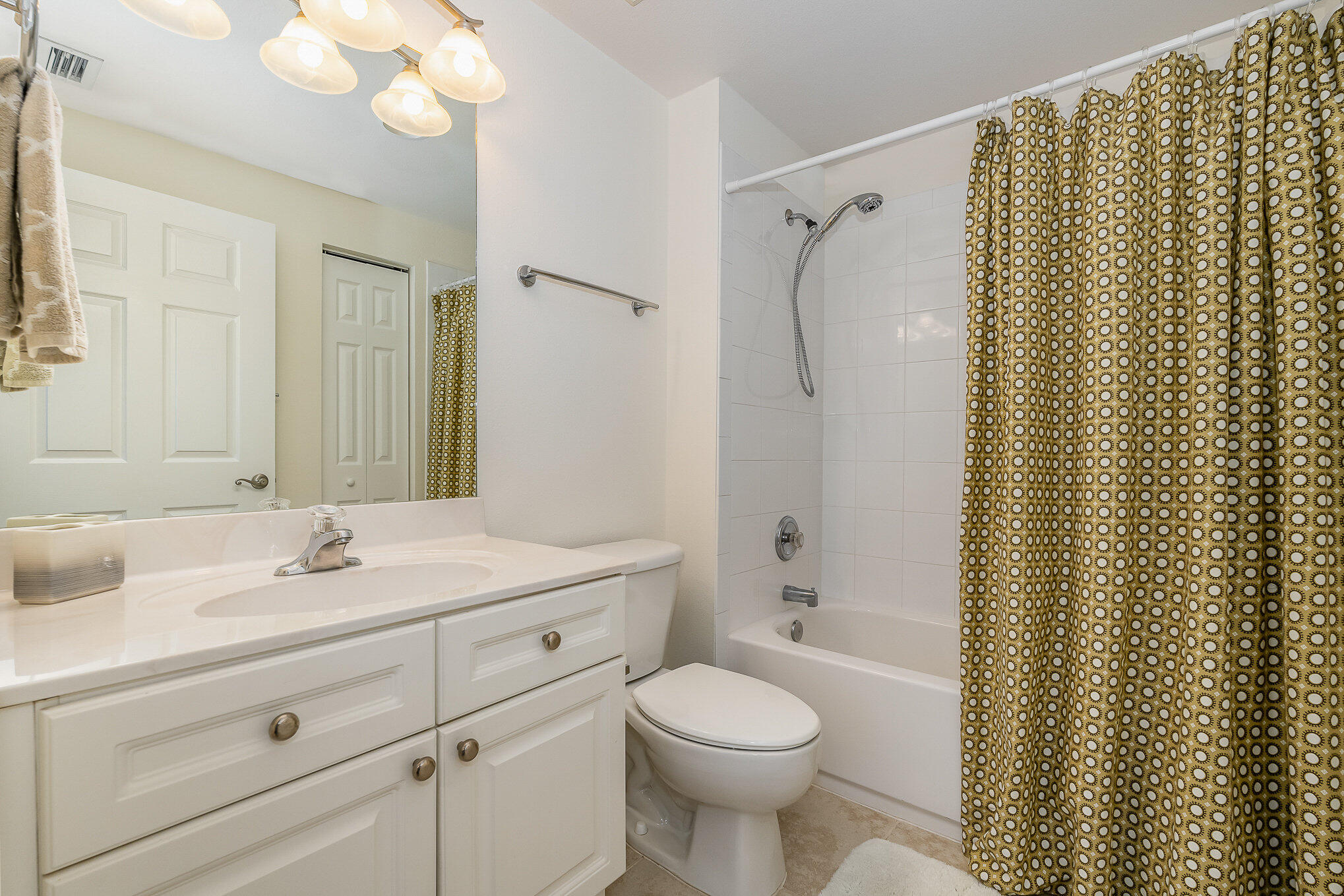 125 Pulsipher Avenue, Unit 402 Cocoa Beach, FL 32931 - Photo 25 of 34 a bathroom with a sink toilet and shower