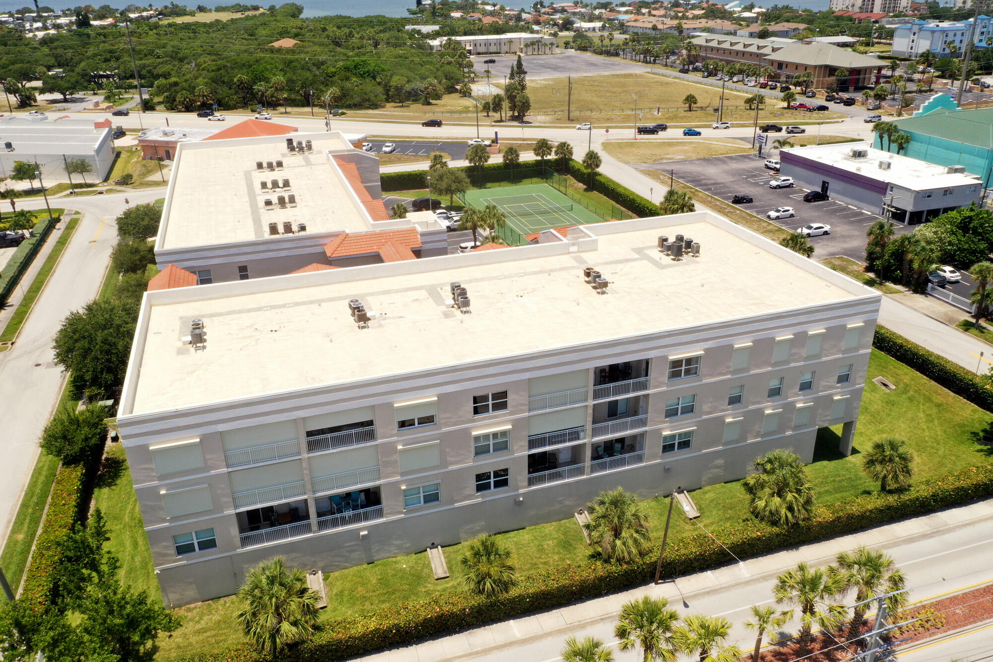 125 Pulsipher Avenue, Unit 402 Cocoa Beach, FL 32931 - Photo 33 of 34 an aerial view of a building with outdoor space