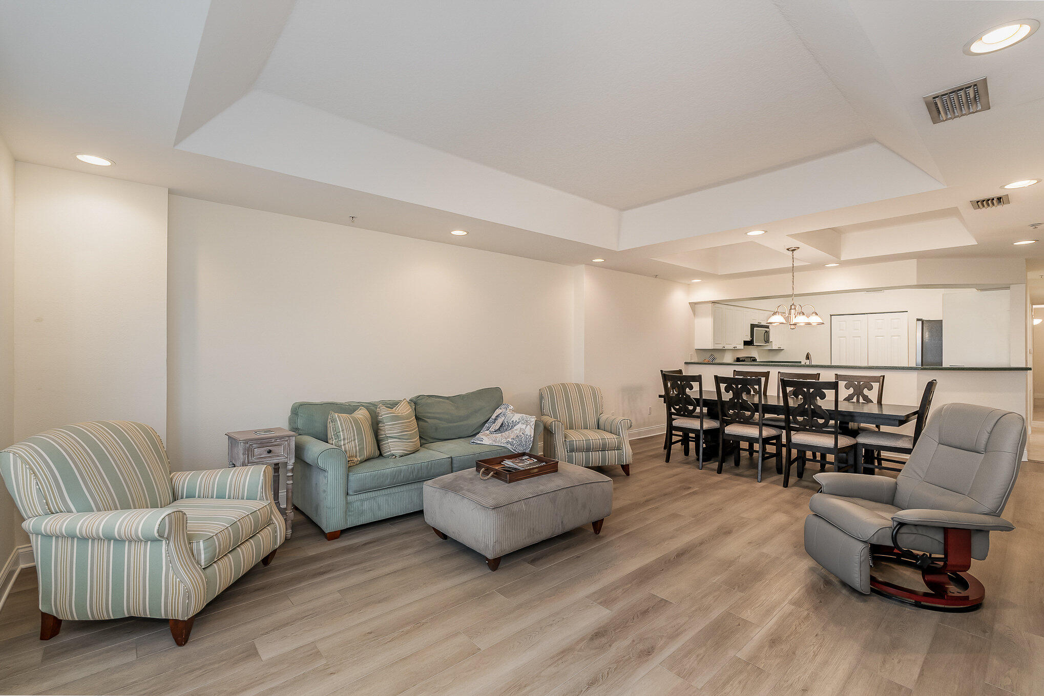 125 Pulsipher Avenue, Unit 402 Cocoa Beach, FL 32931 - Photo 8 of 34 a living room with furniture and a wooden floor