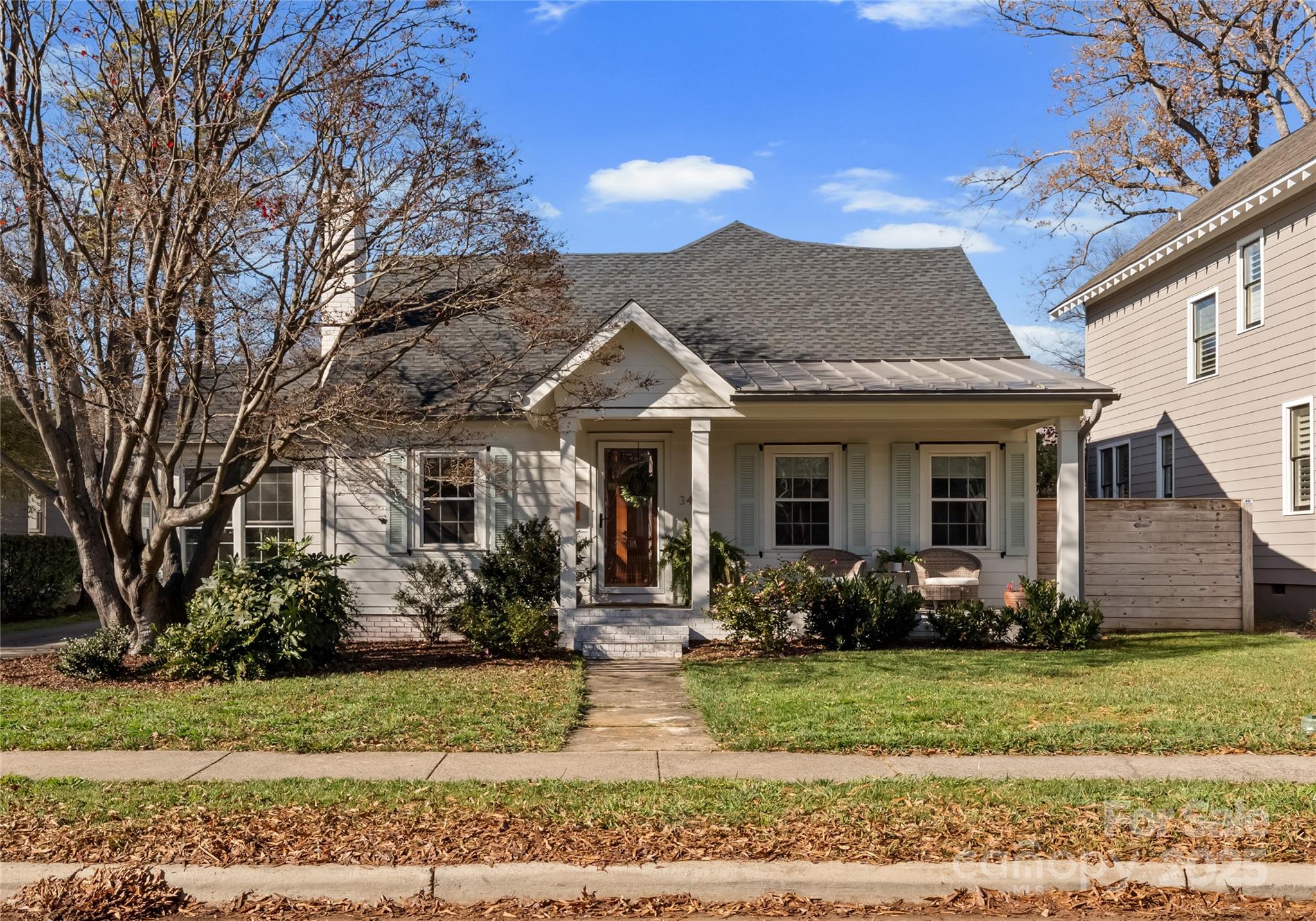 3415 Holt Street Charlotte, NC 28205 - Photo 26 of 48 a front view of a house with garden