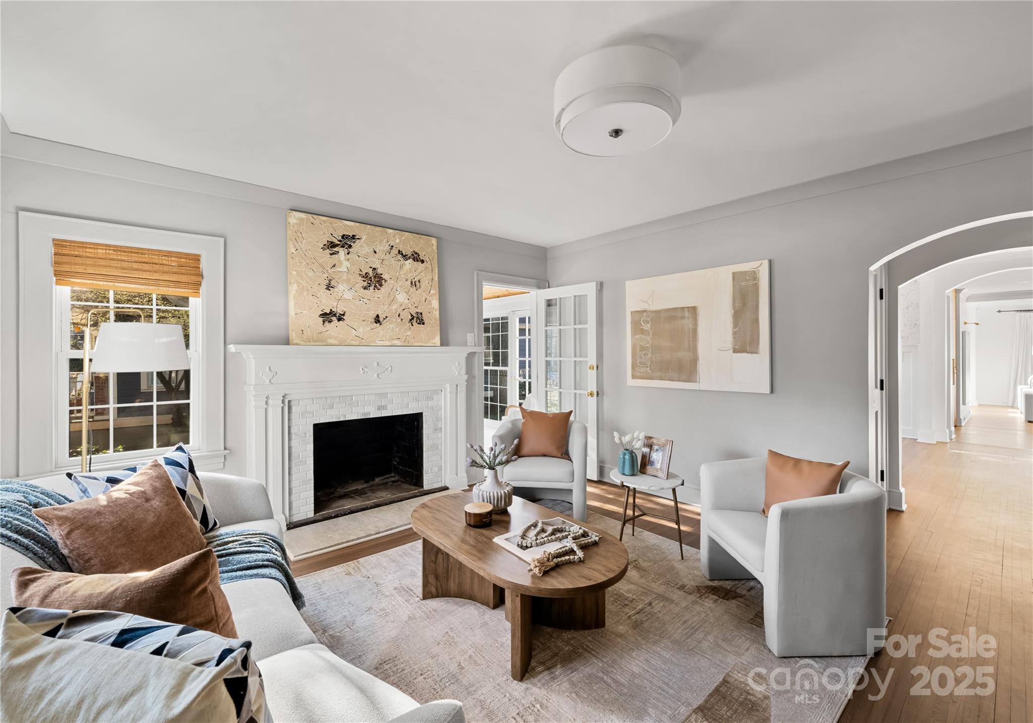 3415 Holt Street Charlotte, NC 28205 - Photo 28 of 48 a living room with furniture and a fireplace