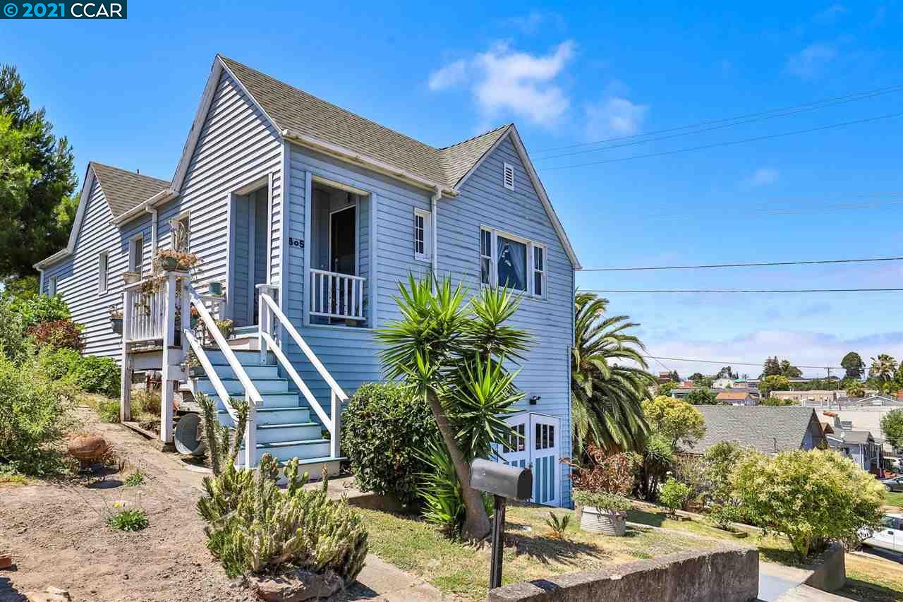 805 First Street Rodeo, CA 94572 - Photo 1 of 1 a house with palm tree in front of it