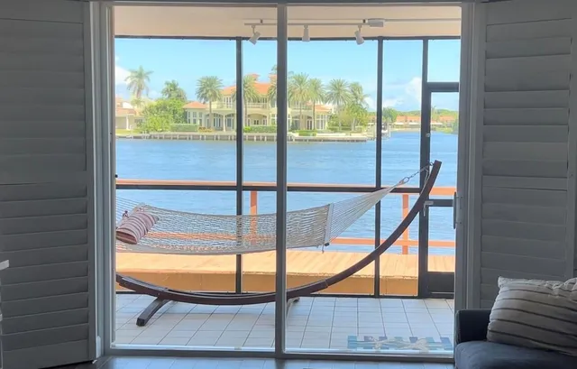 an aerial view of a house with outdoor seating