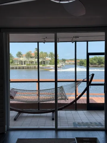 a view of a glass door and deck