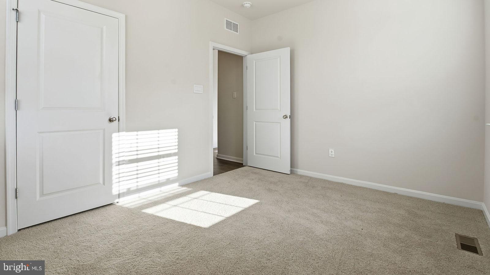 8110 Cypress Pt Drive Rosedale, MD 21237 - Photo 14 of 37 an empty room with windows