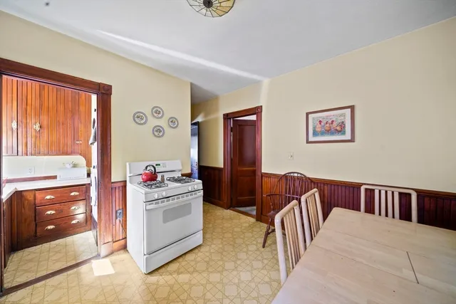 a bathroom with a sink a toilet and shower curtain