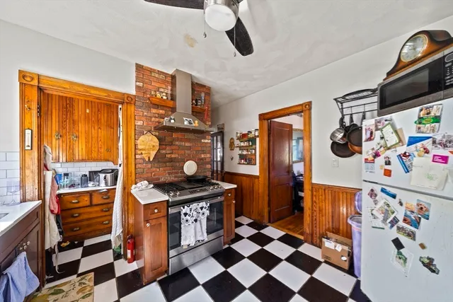 a kitchen with stainless steel appliances a stove a sink dishwasher and cabinets