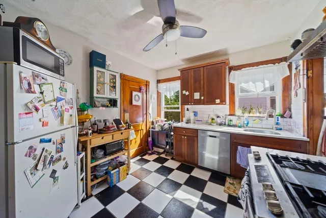 a bedroom with natural light and a large window