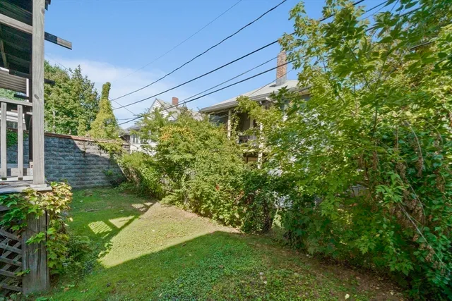 a backyard of a house with lots of green space