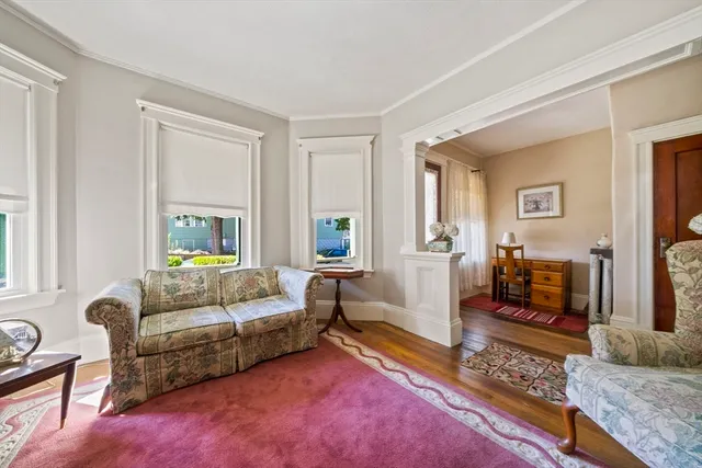 a living room with furniture and a rug