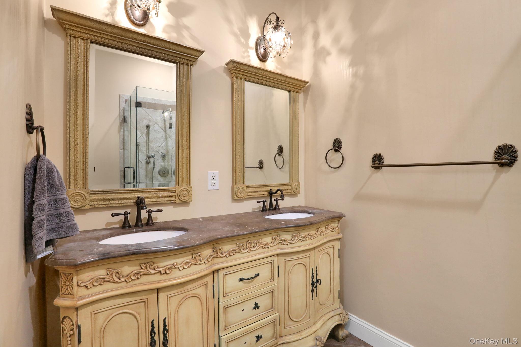 26 Reunion Road Rye Brook, NY 10573 - Photo 19 of 48 a bathroom with a granite countertop sink a mirror and a shower