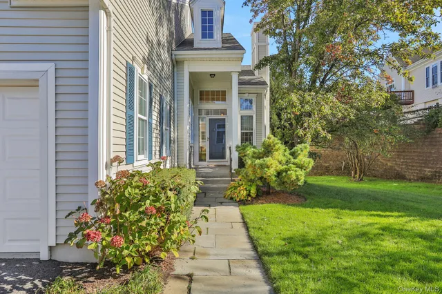 a view of a pathway both side of the house