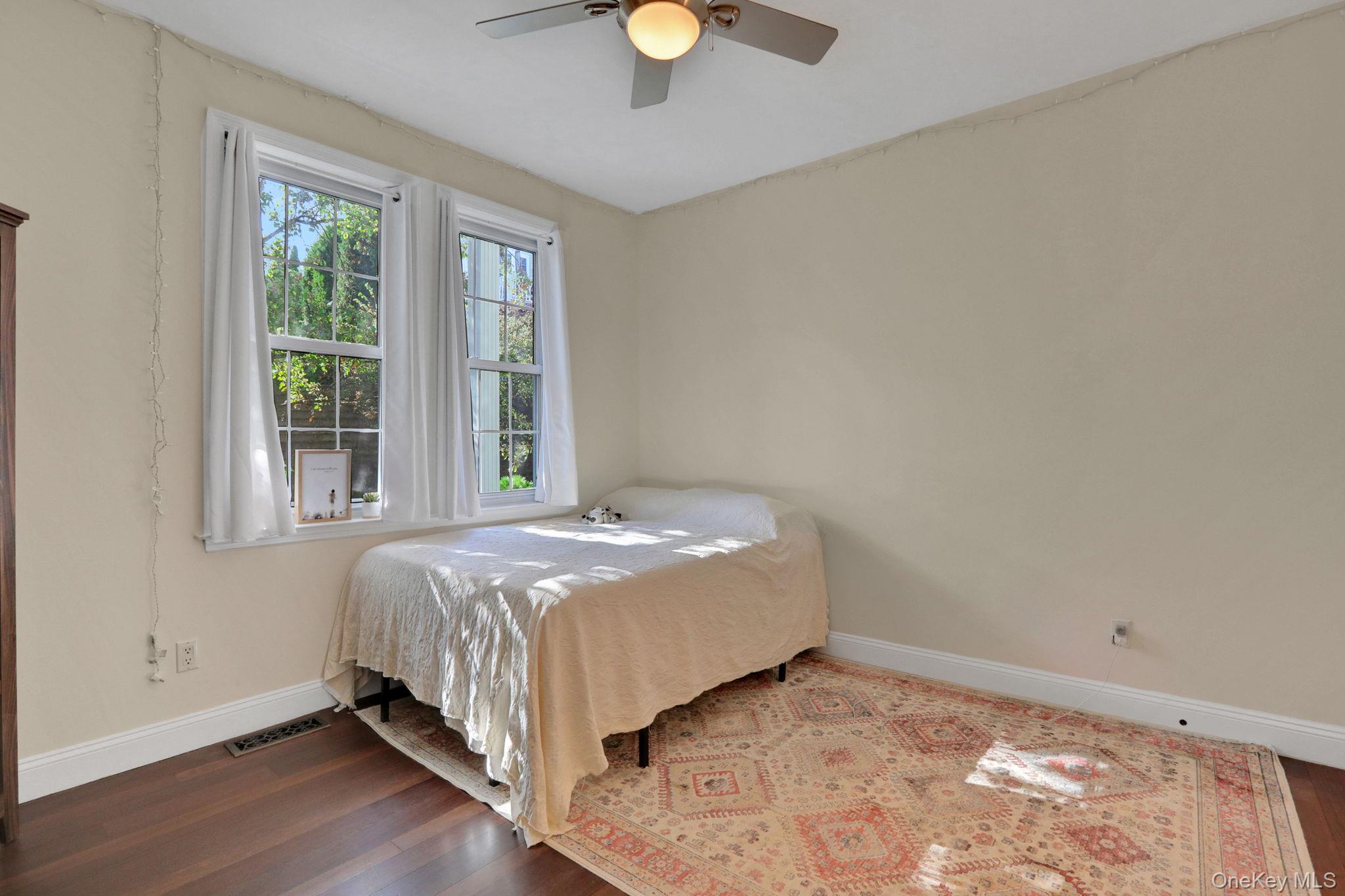 26 Reunion Road Rye Brook, NY 10573 - Photo 21 of 48 a bedroom with a bed and window