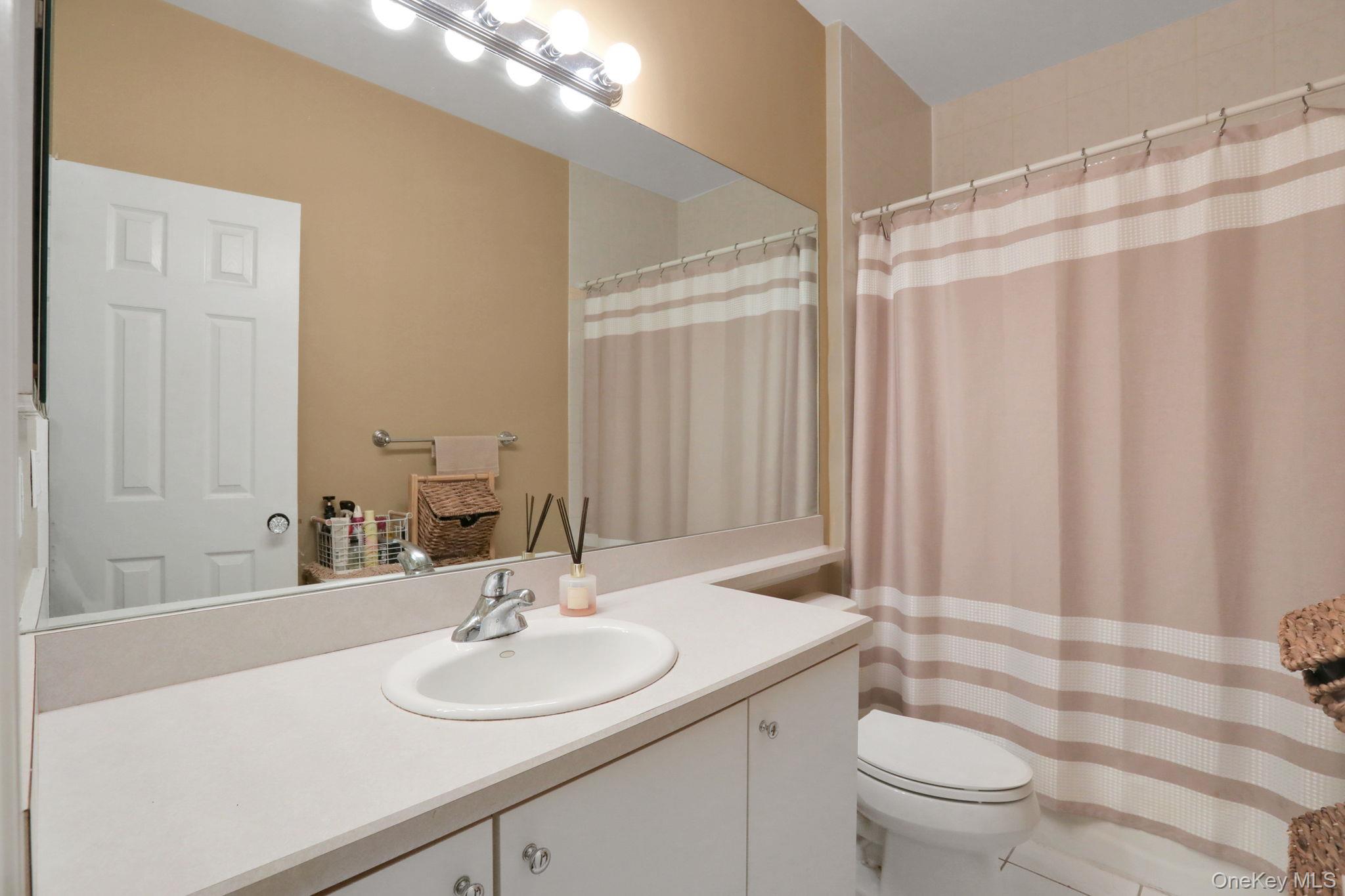26 Reunion Road Rye Brook, NY 10573 - Photo 22 of 48 a bathroom with a sink toilet and shower