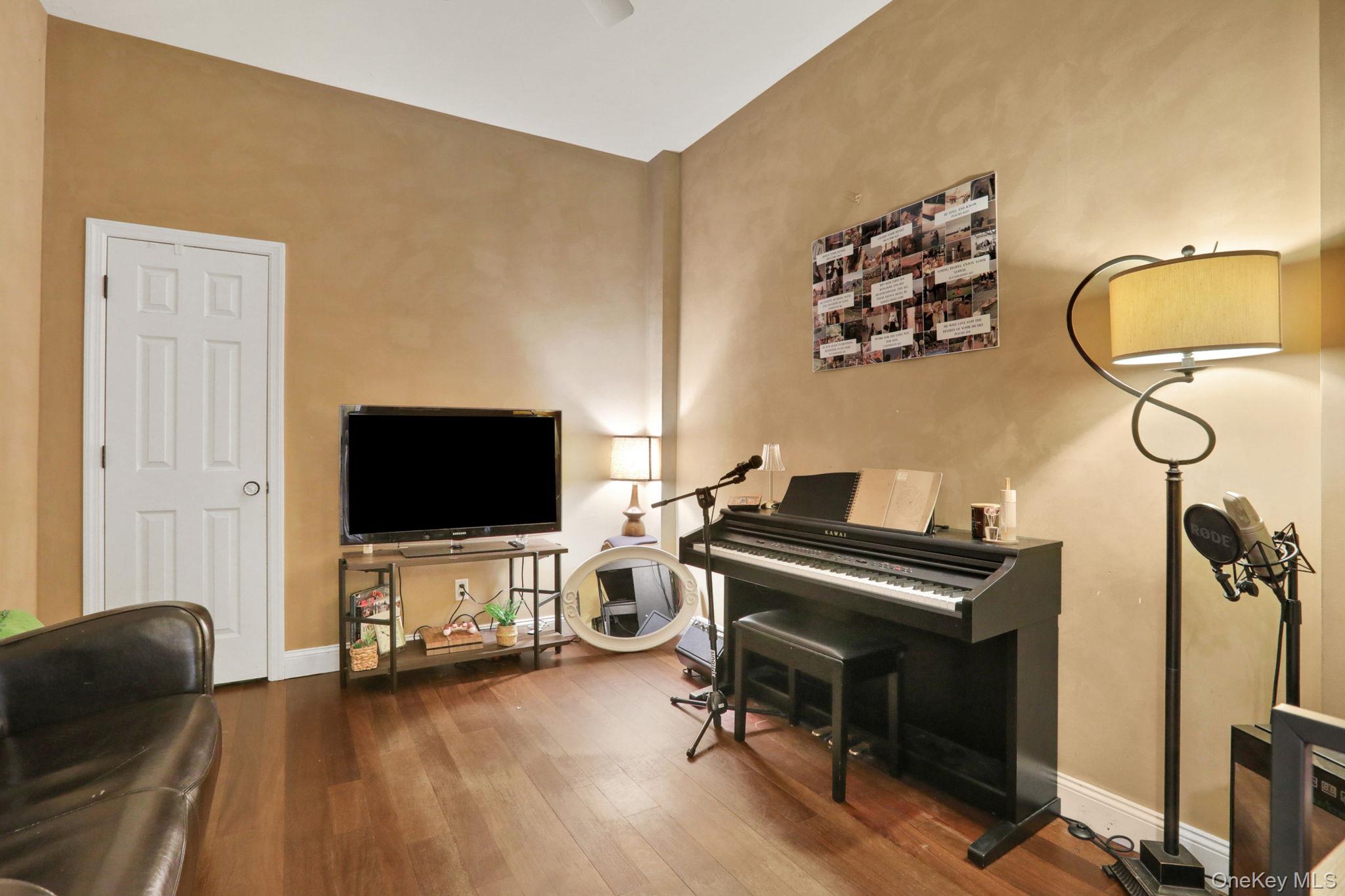 26 Reunion Road Rye Brook, NY 10573 - Photo 23 of 48 a living room with furniture and a flat screen tv