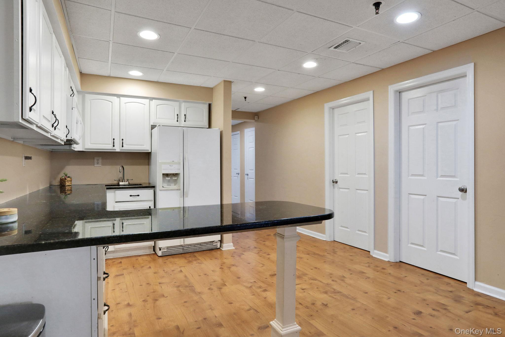 26 Reunion Road Rye Brook, NY 10573 - Photo 26 of 48 a kitchen with stainless steel appliances a refrigerator and a stove top oven