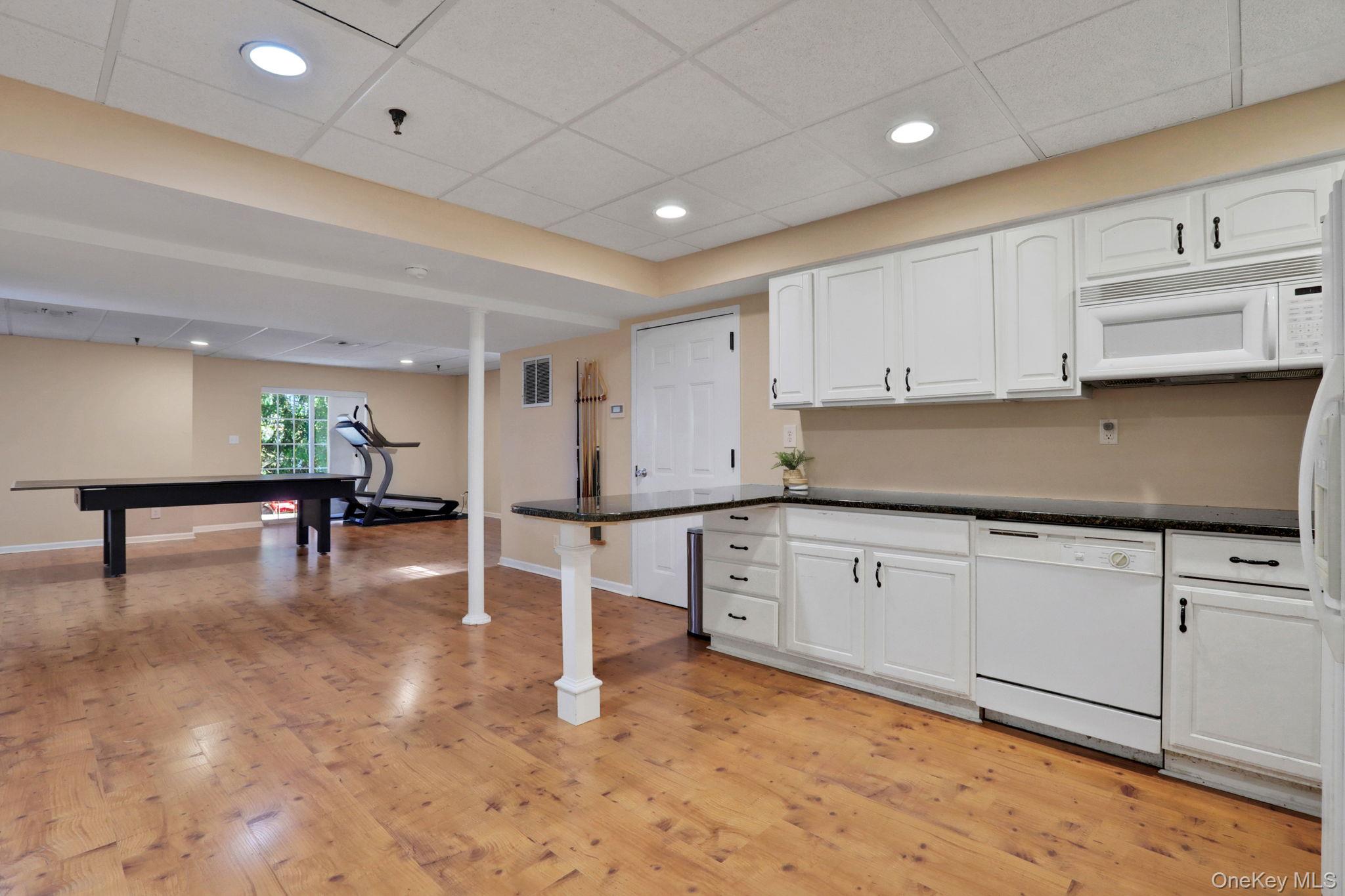 26 Reunion Road Rye Brook, NY 10573 - Photo 27 of 48 a kitchen with granite countertop a stove sink and cabinets