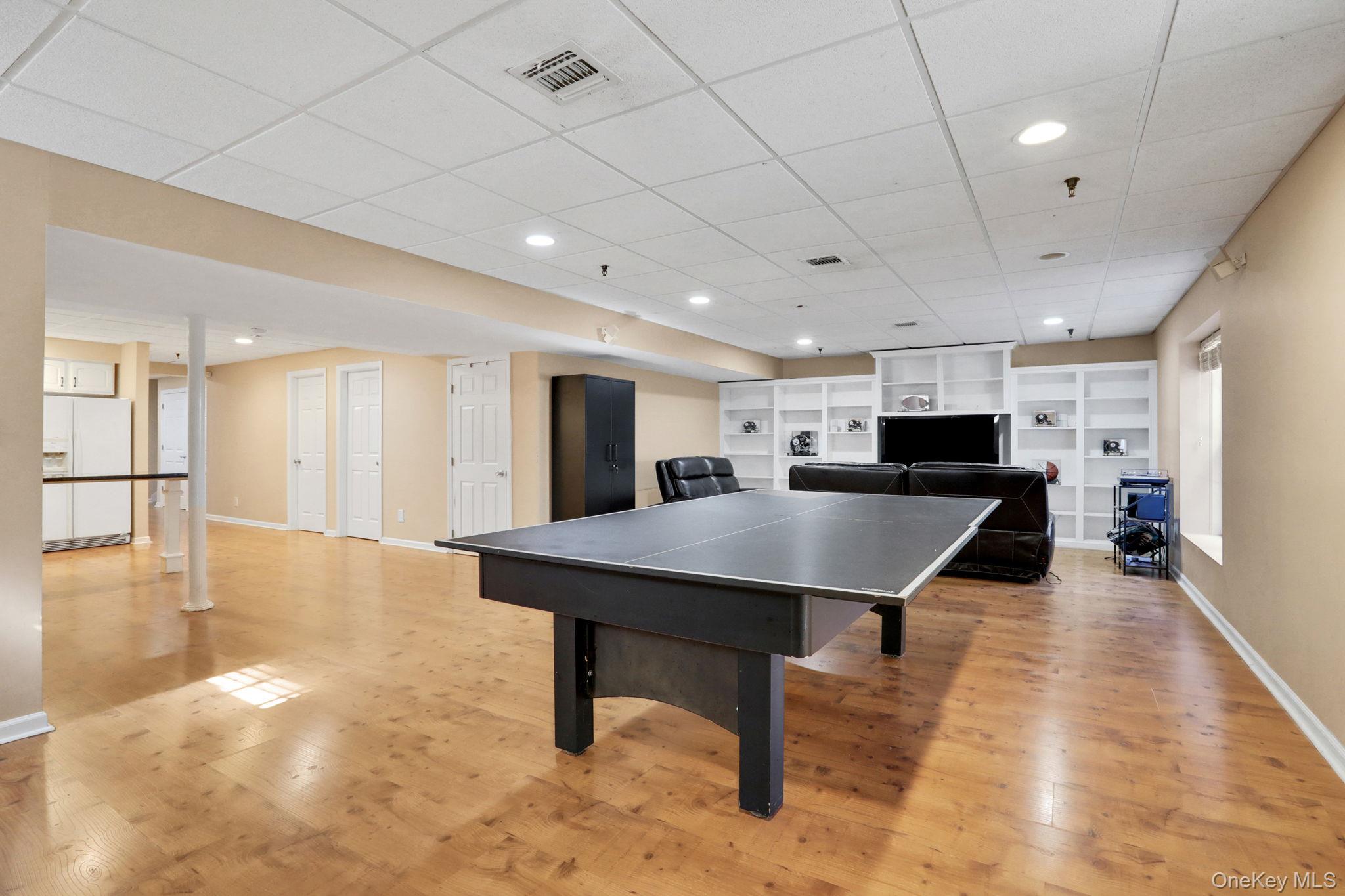 26 Reunion Road Rye Brook, NY 10573 - Photo 29 of 48 a room with furniture and wooden floor