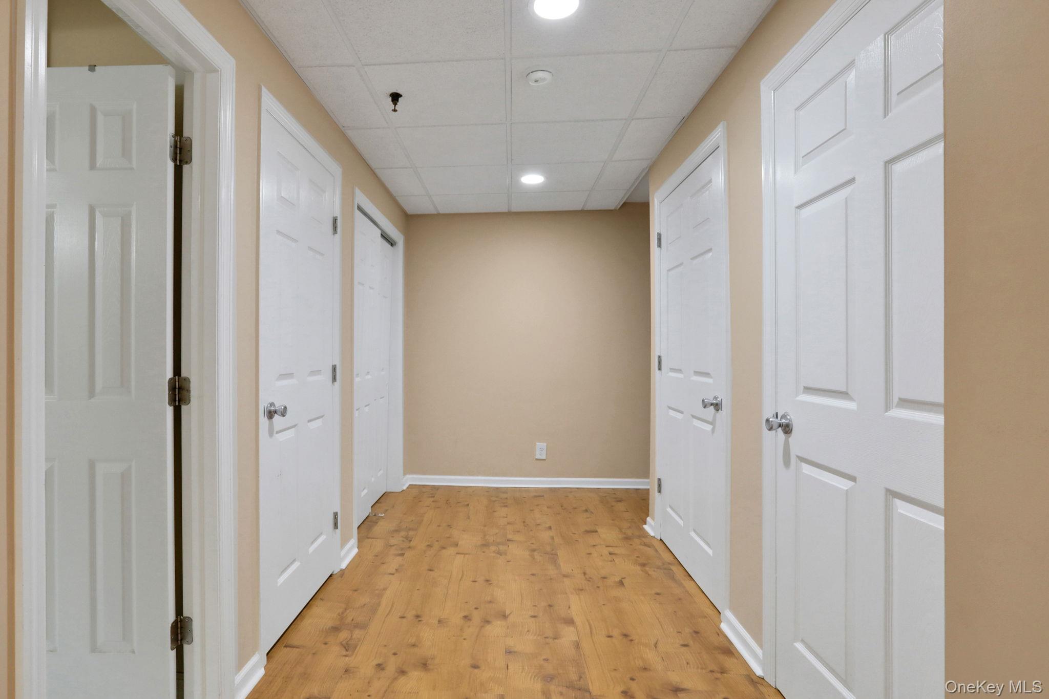 26 Reunion Road Rye Brook, NY 10573 - Photo 31 of 48 a view of hallway with a large mirror and a shower