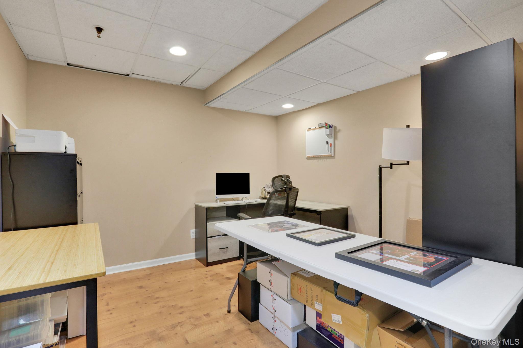 26 Reunion Road Rye Brook, NY 10573 - Photo 33 of 48 a workspace with furniture and flat screen tv