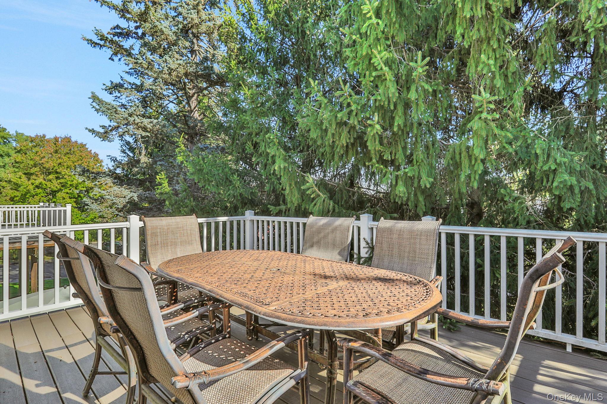 26 Reunion Road Rye Brook, NY 10573 - Photo 35 of 48 a view of a balcony with a table and chairs