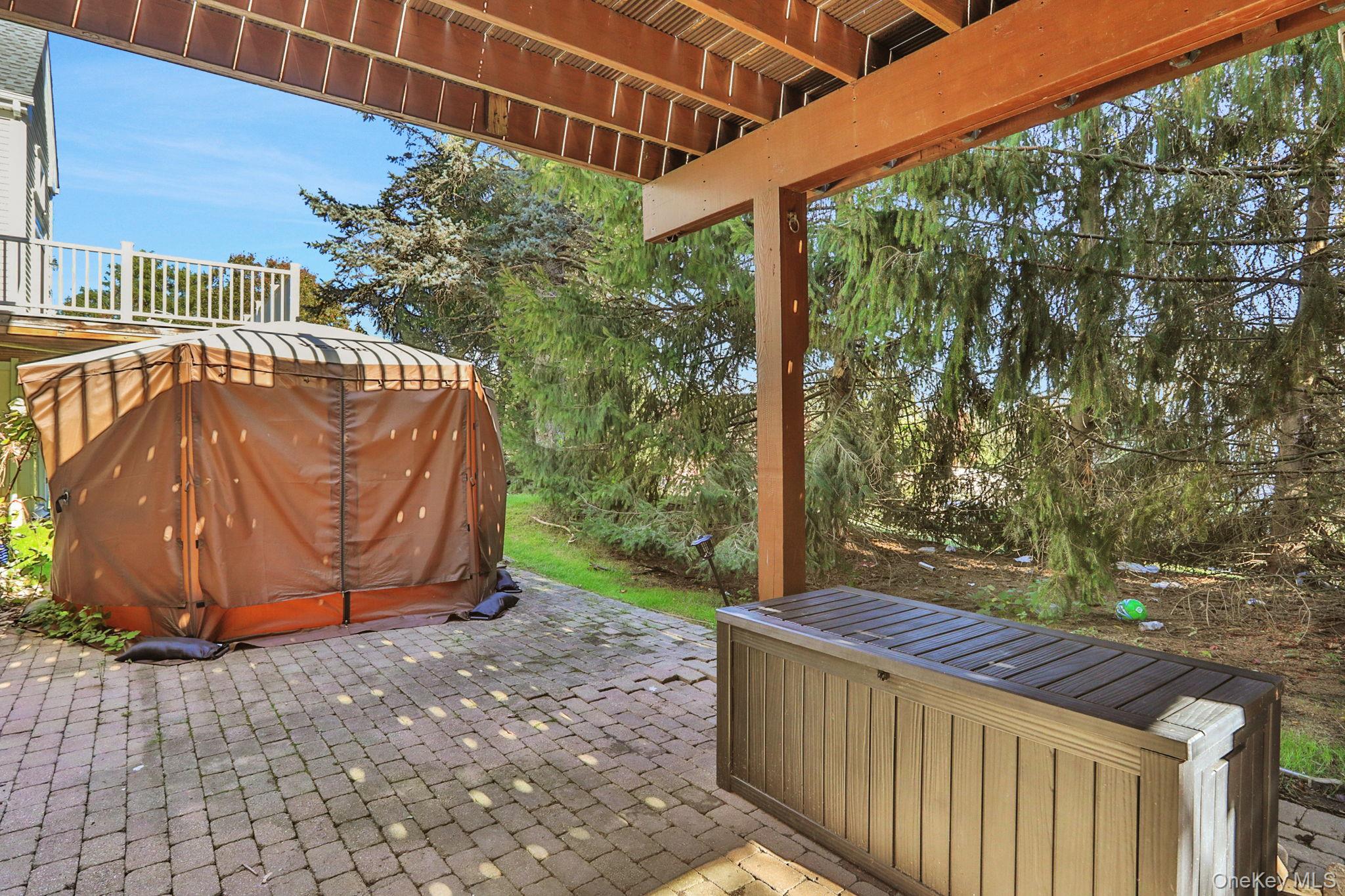26 Reunion Road Rye Brook, NY 10573 - Photo 36 of 48 a view of a backyard with a large tree