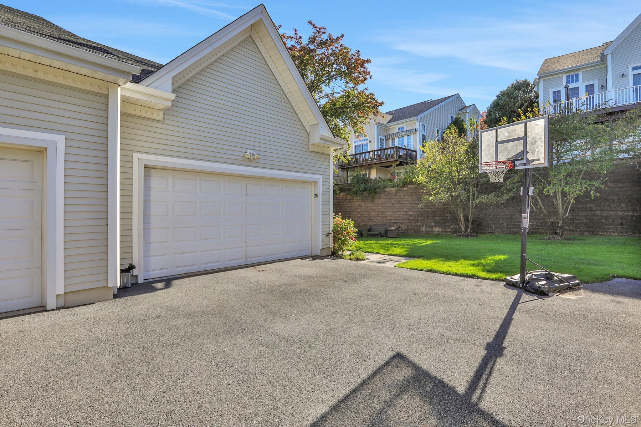 26 Reunion Road Rye Brook, NY 10573 - Photo 37 of 48 a view of a house with a yard and street view