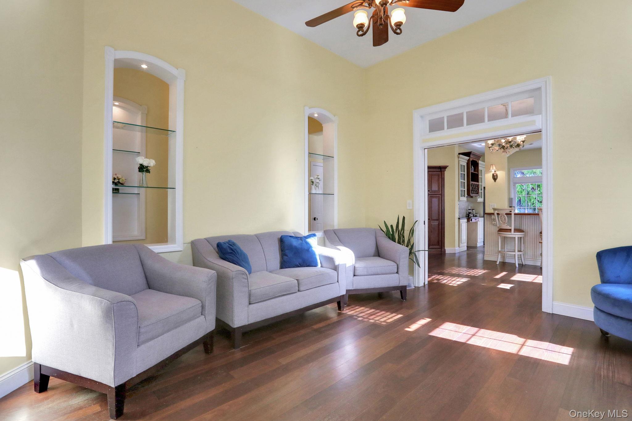 26 Reunion Road Rye Brook, NY 10573 - Photo 6 of 48 a living room with furniture and a chandelier