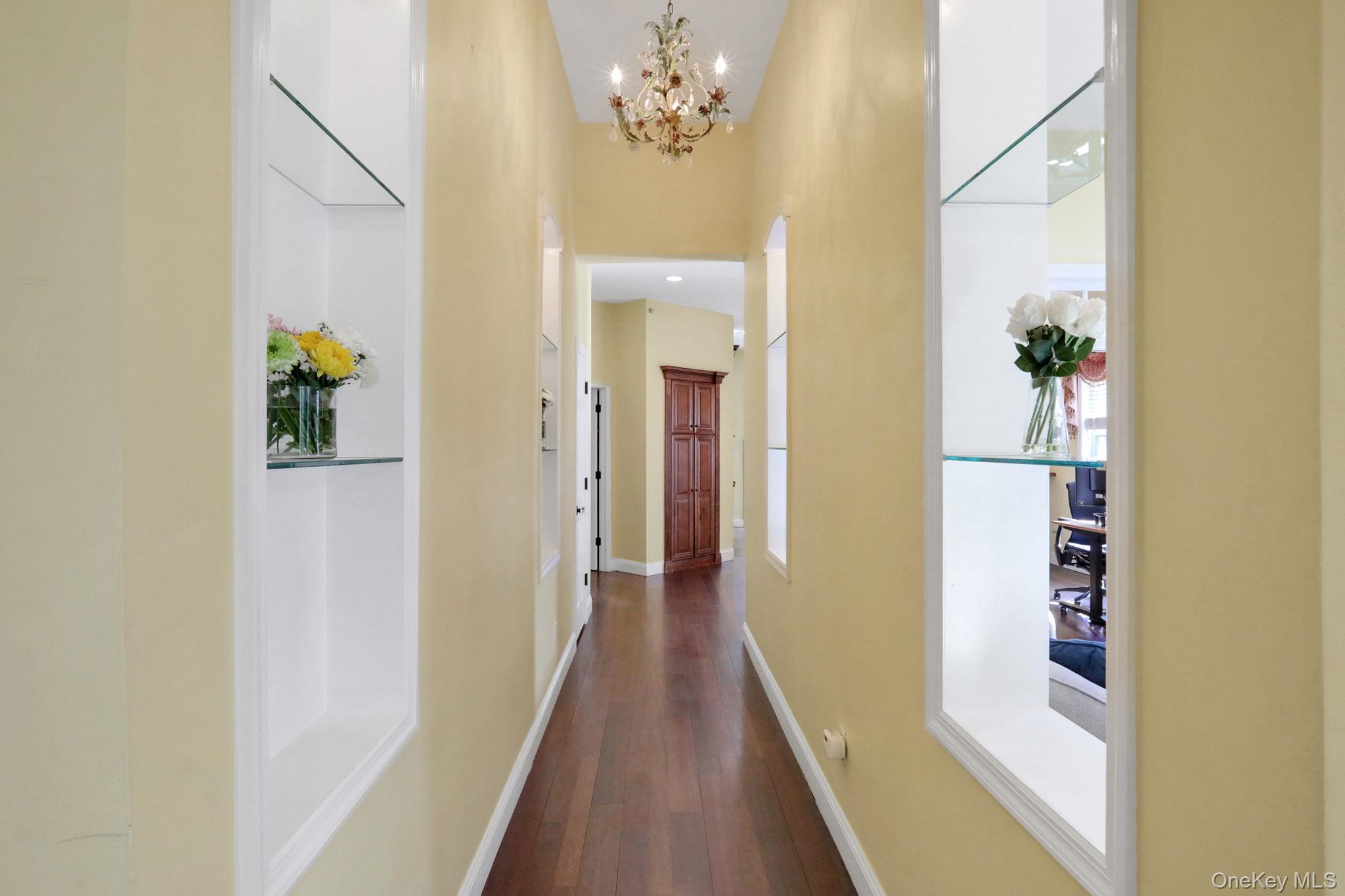 26 Reunion Road Rye Brook, NY 10573 - Photo 8 of 48 a view of a hallway with wooden floor and staircase