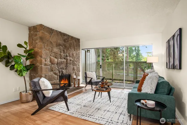 a living room with furniture and a floor to ceiling window
