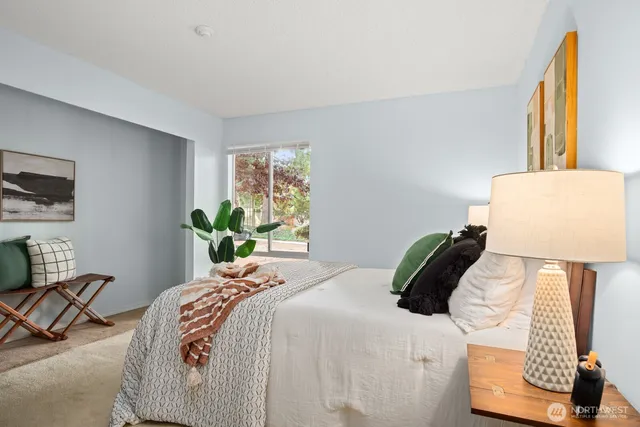 a bedroom with a bed and a dresser