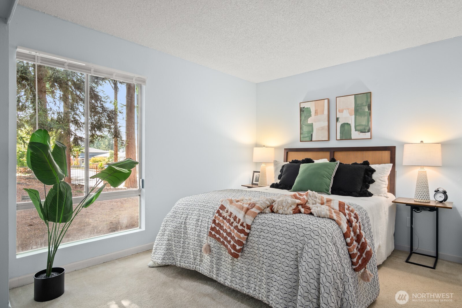 4803 180th Street Southwest, Unit A101 Lynnwood, WA 98037 - Photo 12 of 24 a bedroom with a bed and a large window