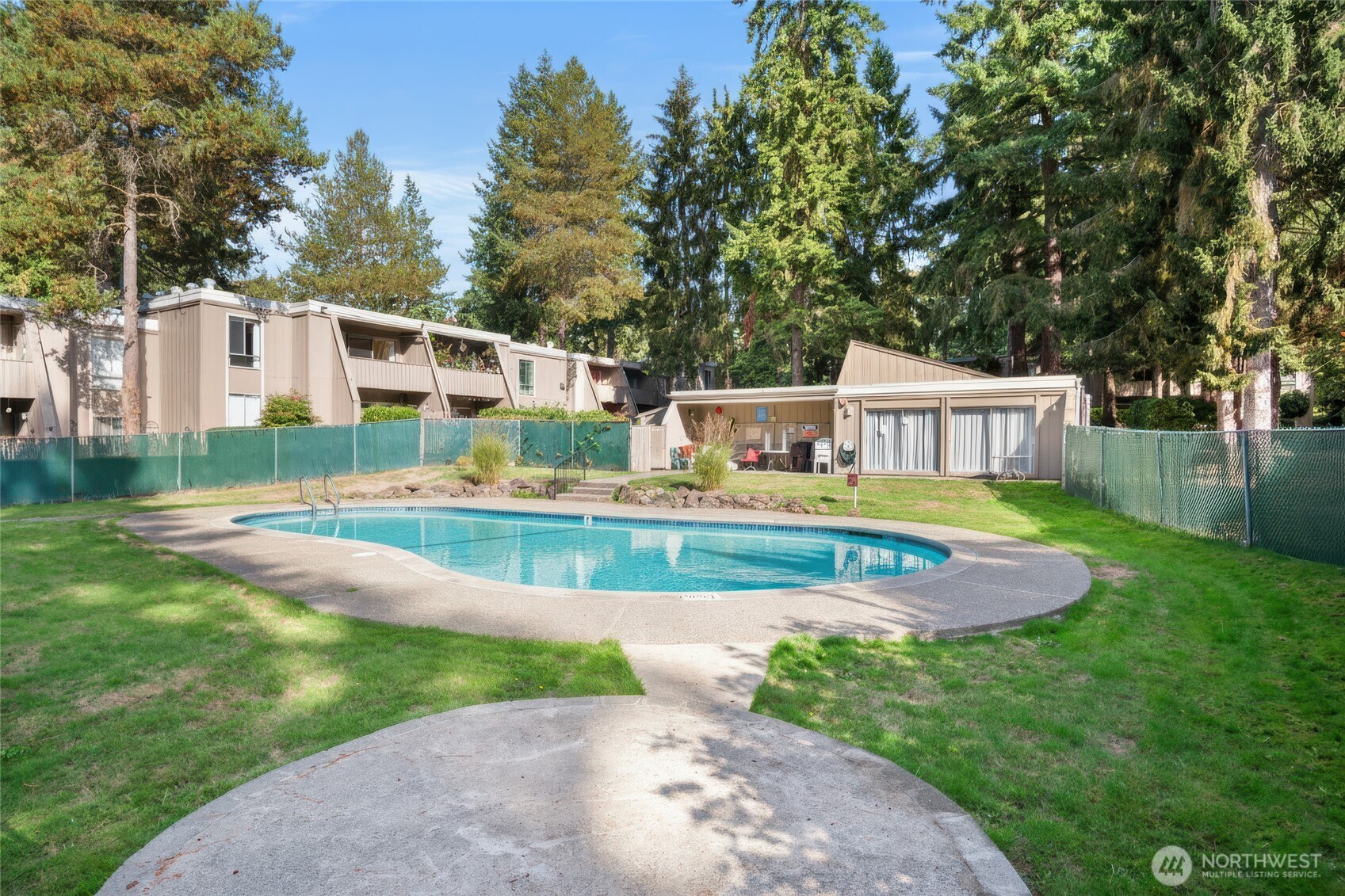 4803 180th Street Southwest, Unit A101 Lynnwood, WA 98037 - Photo 20 of 24 a view of house with swimming pool and yard