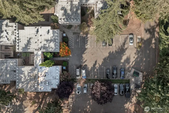 an aerial view of a houses with yard