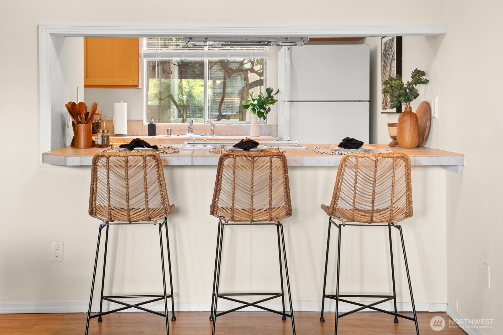 4803 180th Street Southwest, Unit A101 Lynnwood, WA 98037 - Photo 7 of 24 a view of dining room with wooden floor and windows